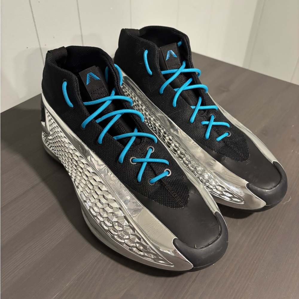 Black and Silver Athletic Shoes with Blue Laces